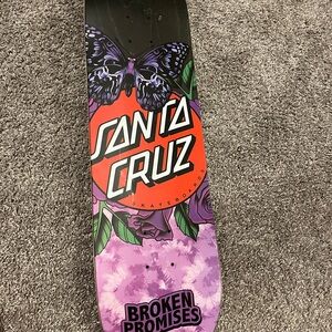 Santa Cruz Skateboard Deck with Purple and Red Design
